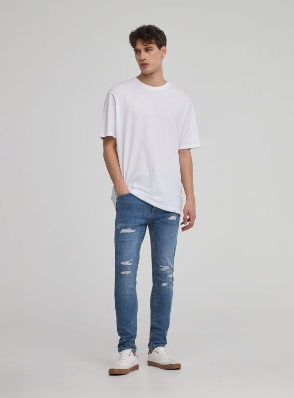 Skinny jeans with ripped effect blue